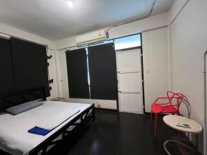 Dreamcatcher Bangkok客房内的一张或多张床位