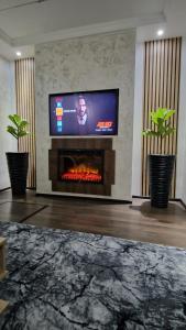 TV a/nebo společenská místnost v ubytování Dominic House