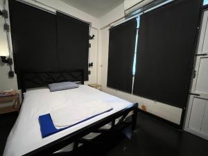 Dreamcatcher Bangkok客房内的一张或多张床位