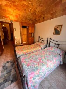 a bedroom with two beds in a room at Il Merlo Verde in Monteverdi Marittimo +69 photos