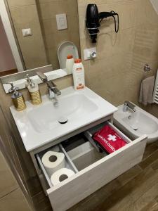 a bathroom with a sink and a toilet at Casa Marisa Pozzuoli in Pozzuoli +14 photos