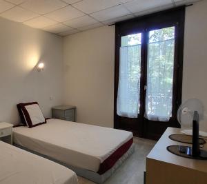 Postel nebo postele na pokoji v ubytování Residence Adele - Chambres d'Hôtes