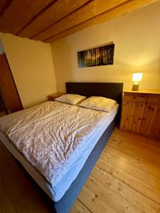 A bed or beds in a room at Zrub Liptovec