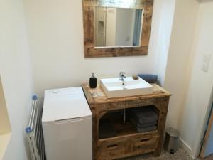 a bathroom with a sink and a mirror on the wall at Merveille du Mont in Météren +33 photos