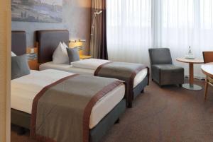 Letto o letti in una camera di Ramada by Wyndham Dresden