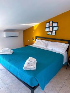 Postel nebo postele na pokoji v ubytování Casa Polgabe - Quadrilocale con vista - Assisi