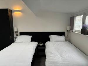 Ένα ή περισσότερα κρεβάτια σε δωμάτιο στο Williamson Suites - Apartment 2