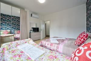 Postel nebo postele na pokoji v ubytování R & R Apartment