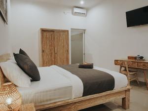 Cama ou camas em um quarto em pondok arsa canggu
