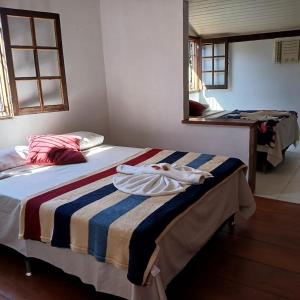 Postel nebo postele na pokoji v ubytování Villa dos Pássaros Paraty Hospedagem