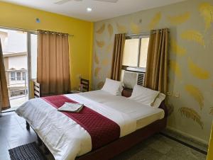 Postel nebo postele na pokoji v ubytování Hotel Swagat