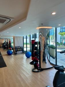a gym with a room with a lot of exercise equipment at Duplex Luxury Apartments in 5 Star Hotel in Rawai Beach