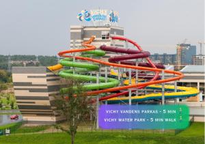 a water slide in front of a water park at Apartment with a large balcony in Vilnius