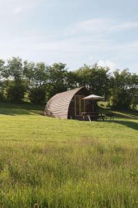 a yurt in the middle of a field at Brecon by Wigwam Holidays in Brecon