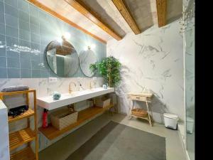 a bathroom with a sink and a mirror at Apartment Rafol in Vilanova i la Geltrú +28 photos