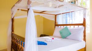 Postel nebo postele na pokoji v ubytování Sands Inn Hotel