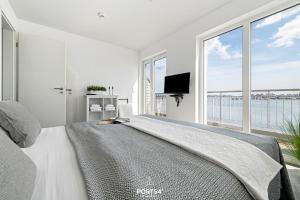 Μια τηλεόραση ή/και κέντρο ψυχαγωγίας στο Ferienhaus Strandnest Olpenitz