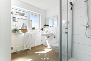 Ένα μπάνιο στο Ferienhaus Strandnest Olpenitz +24 φωτογραφίες