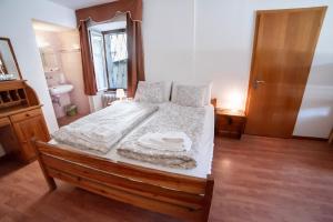 Postel nebo postele na pokoji v ubytování Hotel Des Alpes - Restaurant & Pizzeria