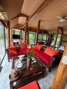 a living room with red pillows and a table at Sapawine Homestay in Sa Pa +32 photos