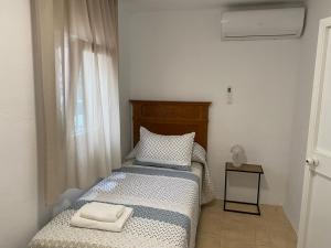 Postel nebo postele na pokoji v ubytování Casa Meme Nerja