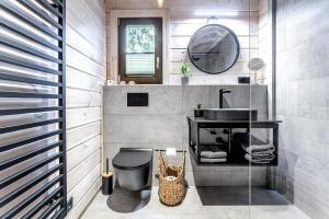 a bathroom with a sink and a toilet and a mirror at Finskä chata in Samopše +38 photos