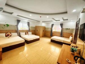 Postel nebo postele na pokoji v ubytování SixPearl Hotel