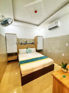 Postel nebo postele na pokoji v ubytování SixPearl Hotel
