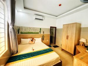 Postel nebo postele na pokoji v ubytování SixPearl Hotel