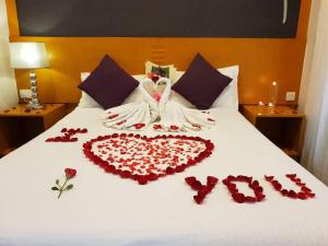 a bed with a heart made out of red roses at Cameron Nova Highlands Resorts II in Brinchang