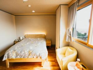 Voodi või voodid majutusasutuse Ocean View Hiromi SPA Hotel温泉と絶景の宿 toas