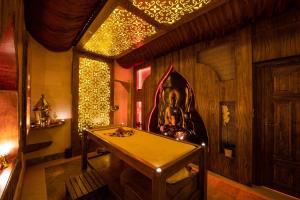 a room with a table and lights on the wall at Kapadokya Hill Hotel & Spa in Nevşehir