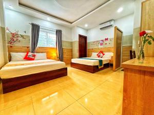 Postel nebo postele na pokoji v ubytování SixPearl Hotel