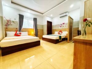 Postel nebo postele na pokoji v ubytování SixPearl Hotel