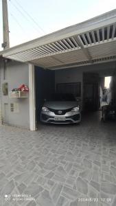 a car is parked inside of a garage at Casa cachoeira dos tourinhos in Massaguassu
