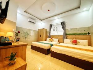 Postel nebo postele na pokoji v ubytování SixPearl Hotel