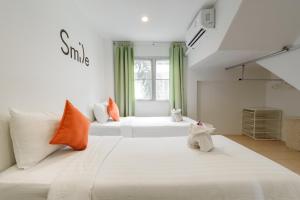 Postel nebo postele na pokoji v ubytování Little Home Ao Nang