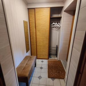 a walk in shower with a bench in a room at Suure terrassiga korter raudteejaama lähedal in Viljandi +6 photos