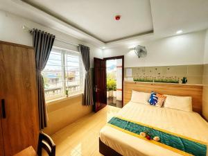 Postel nebo postele na pokoji v ubytování SixPearl Hotel