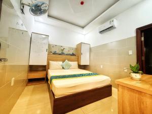 Postel nebo postele na pokoji v ubytování SixPearl Hotel
