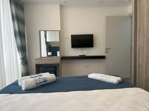 Кровать или кровати в номере Nurel Shark Residence