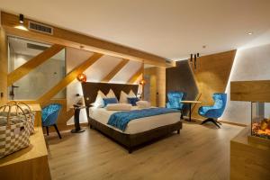 Postel nebo postele na pokoji v ubytování Adler Hotel Wellness & Spa - Andalo