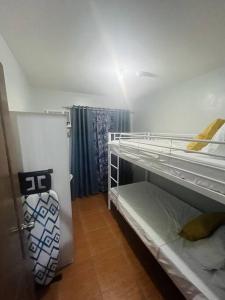 Postel nebo postele na pokoji v ubytování JHJ Condo Unit Rental