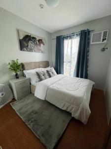 Postel nebo postele na pokoji v ubytování JHJ Condo Unit Rental + 15 fotografií