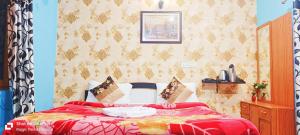 Hotel Anand LOK客房内的一张或多张床位