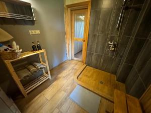 an overhead view of a bathroom with a shower at Brīvdienu māja Straumēni in Pāle