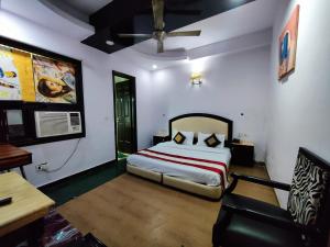 Postel nebo postele na pokoji v ubytování HOTEL ASKO INTERNATIONAL-Karol Bagh