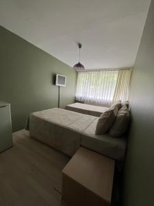 Ένα ή περισσότερα κρεβάτια σε δωμάτιο στο BİODA Boardinghouse