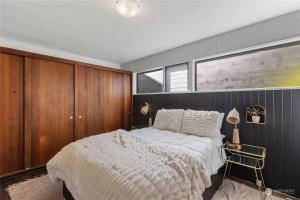 a bedroom with a large bed and a window at 1BR 1BA Emerald Garden Bliss Seattle Location in Seattle