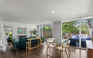 a living room with a couch and a table at 1BR 1BA Emerald Garden Bliss Seattle Location in Seattle